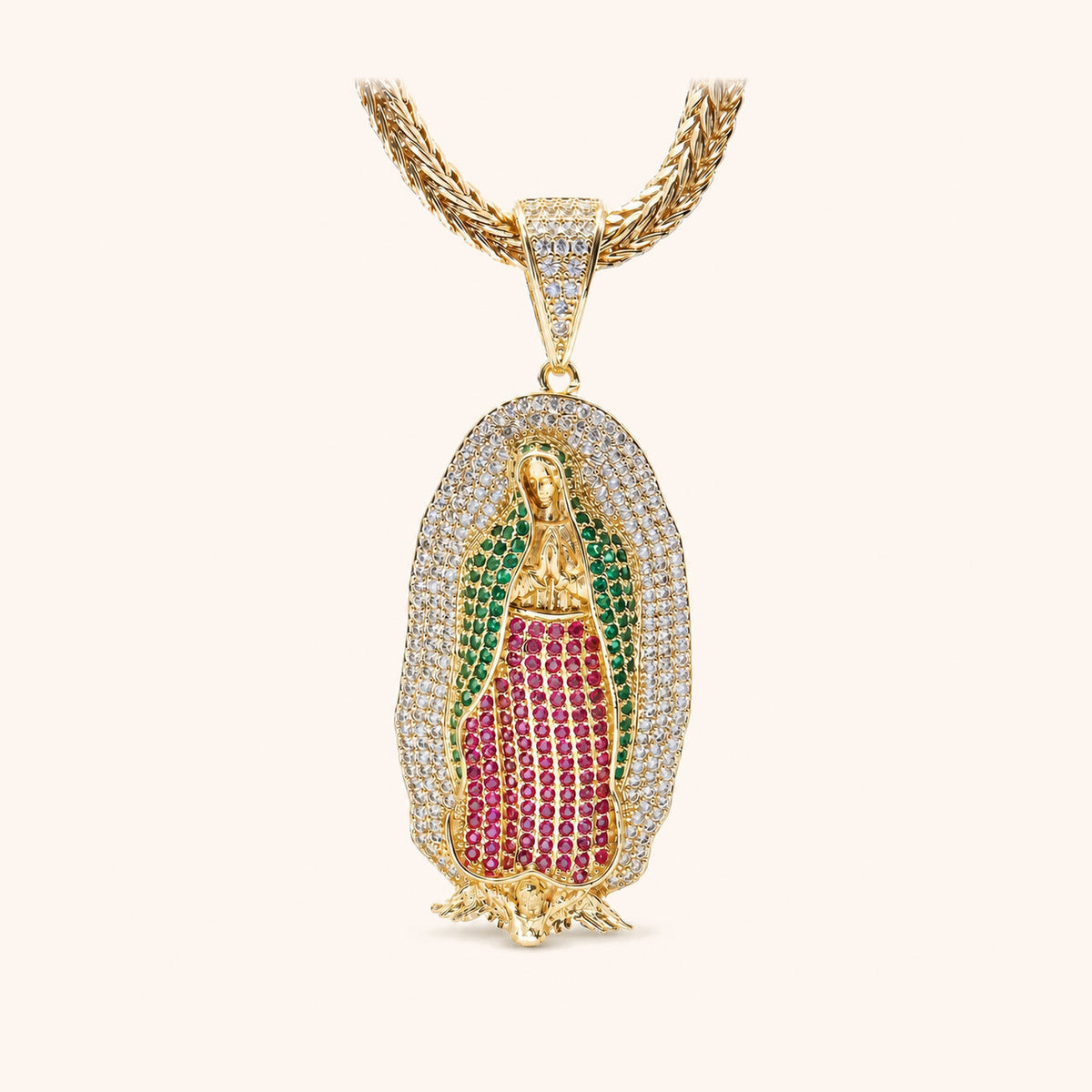 Gold-colored rope chain and Guadalupe pendant with green, pink and clear decorative details.