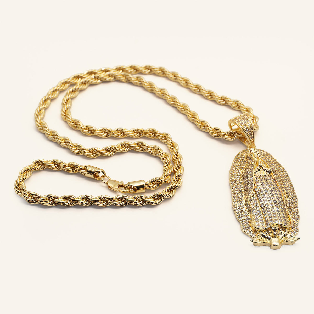 Gold plated rope chain with lobster clasp and Virgen de Guadalupe pendant laid flat