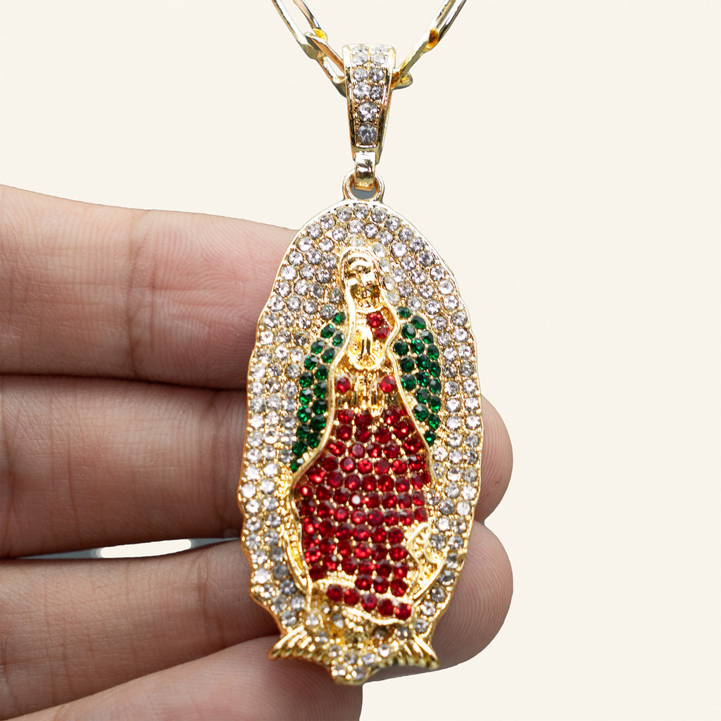 Virgen de Guadalupe iced pendant held in hand, angled view