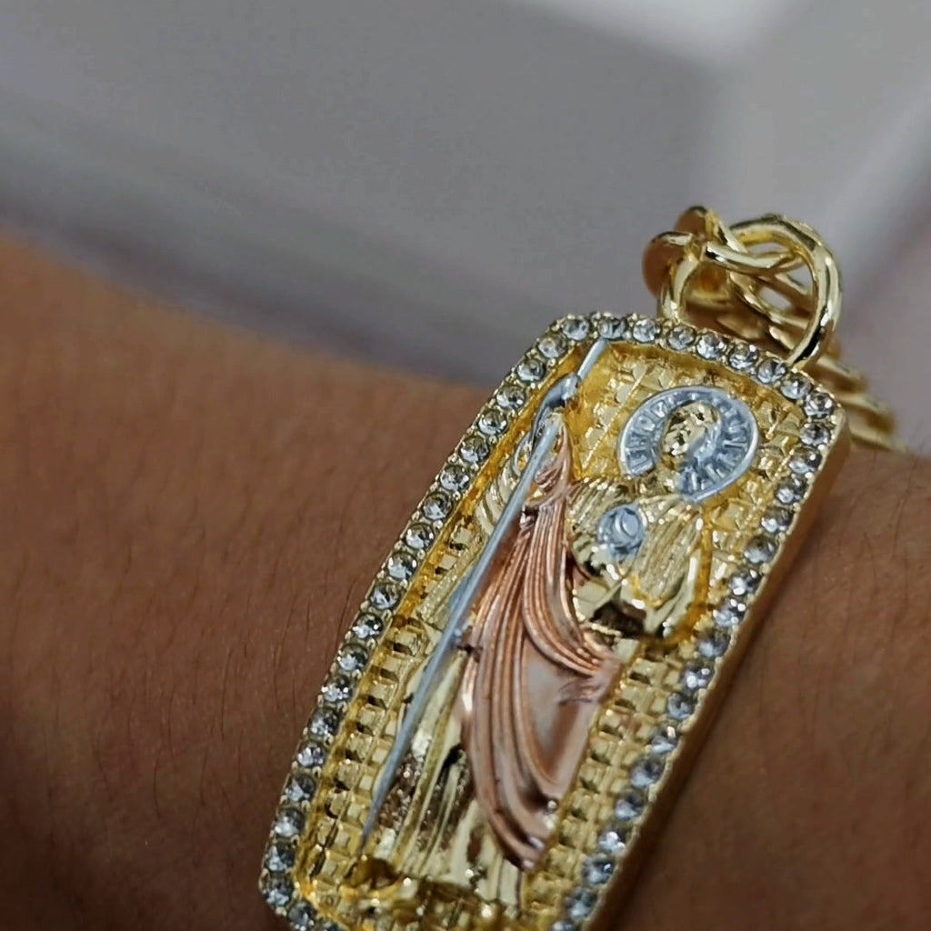 San Judas Tadeo tri-tone ID bracelet worn on the wrist, close-up