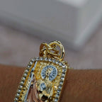 San Judas Tadeo ID bracelet on the wrist, side angle showing the Cuban link