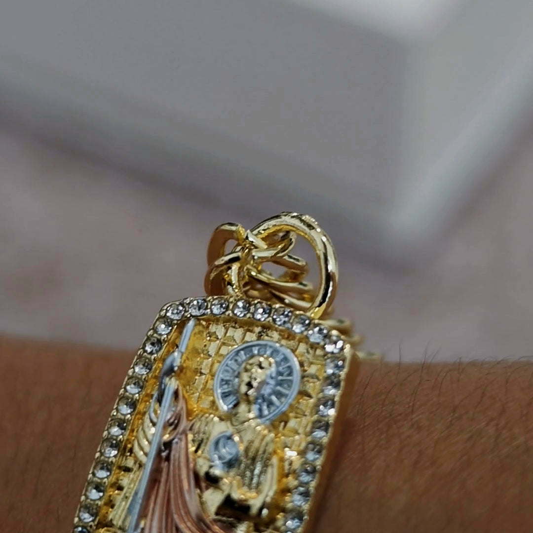 San Judas Tadeo ID bracelet on the wrist, side angle showing the Cuban link