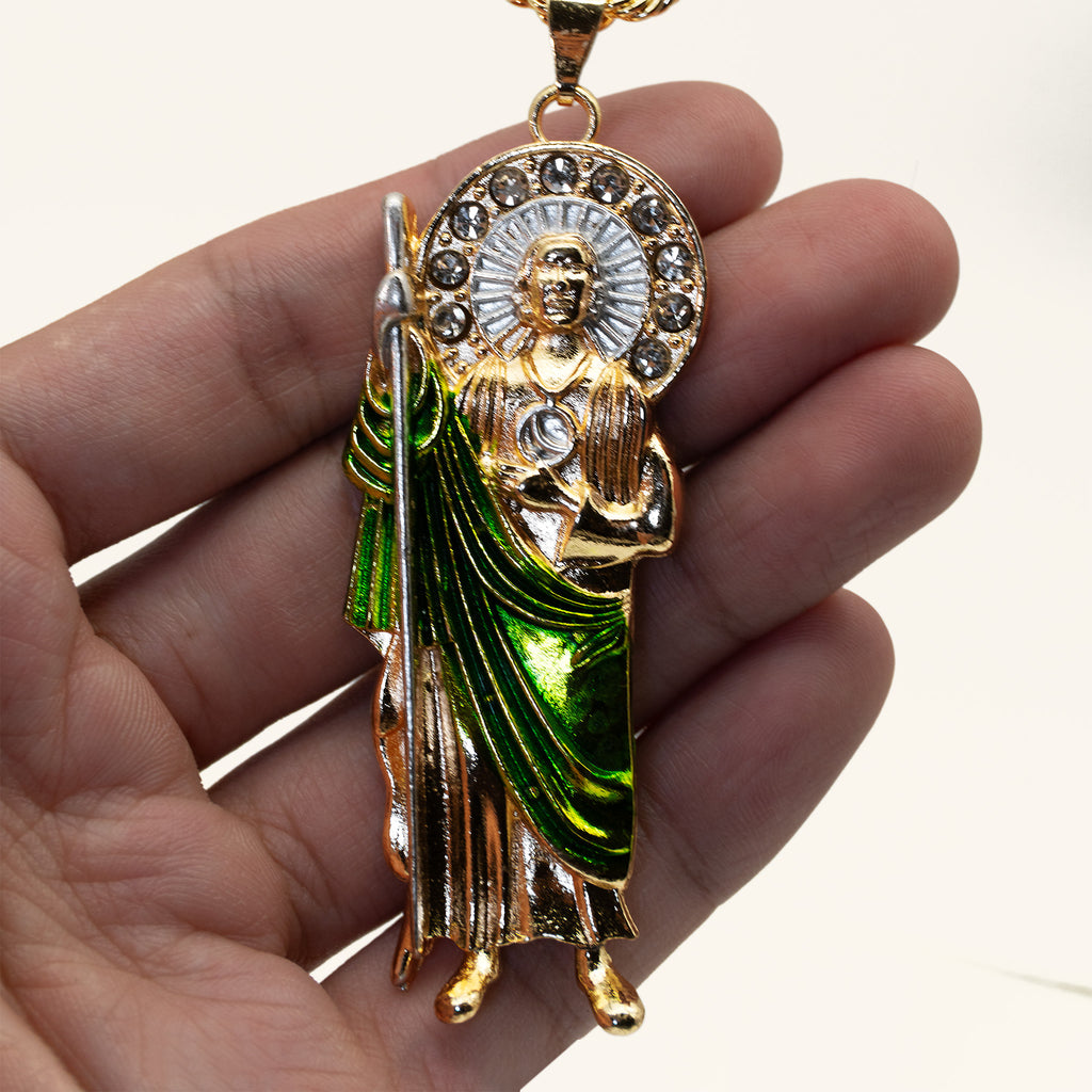 San Judas Tadeo green enamel robe pendant held in hand to show its size